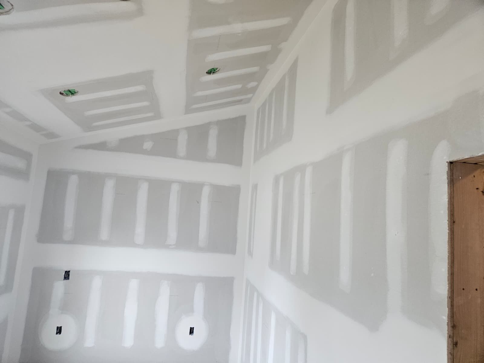 Room with walls and ceiling taped and mudded