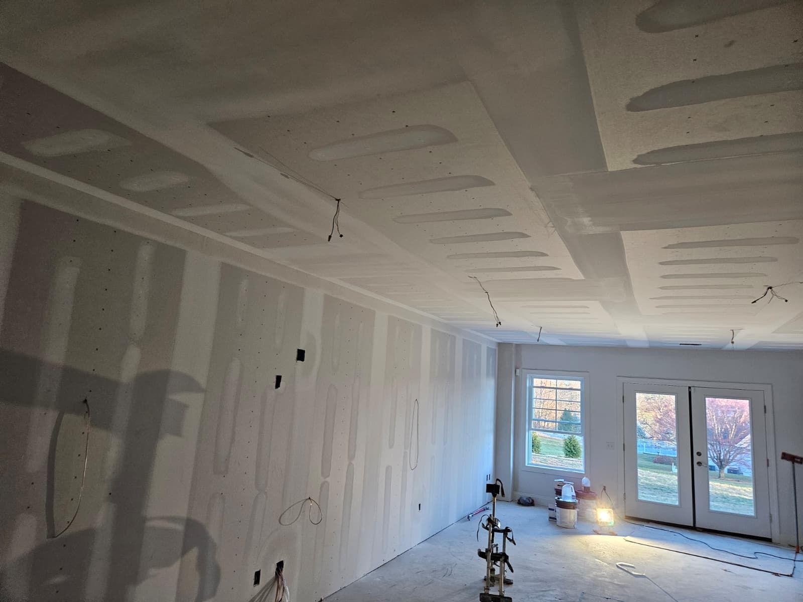 New home lower level hung and mudded, ready for finish