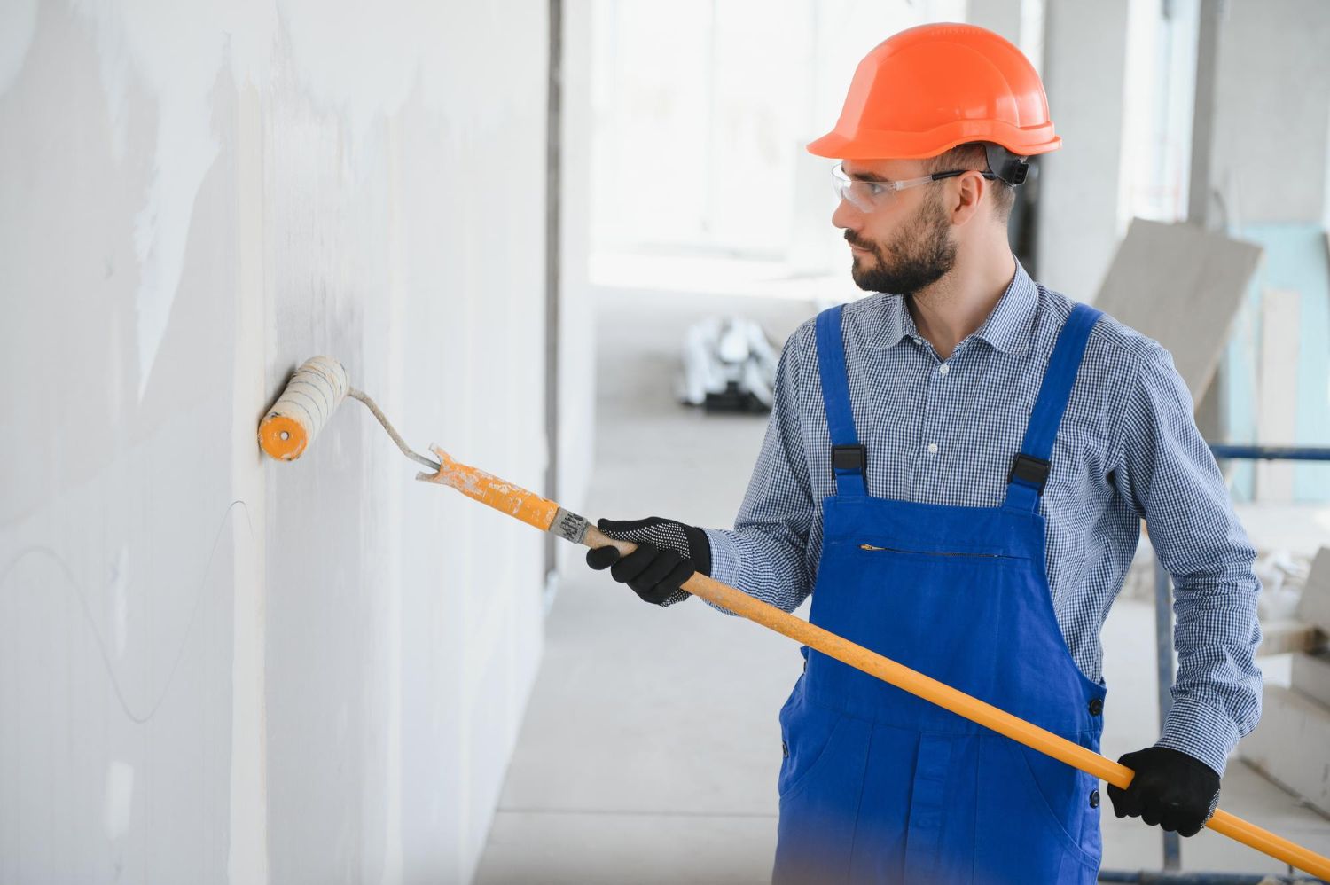 Rolling paint on a smooth interior wall