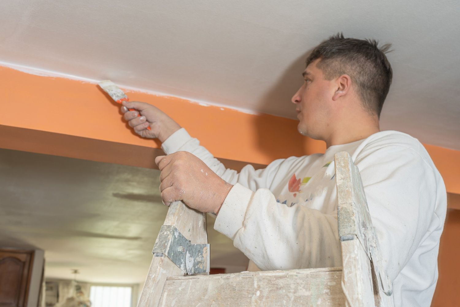 Cutting in paint along the ceiling line