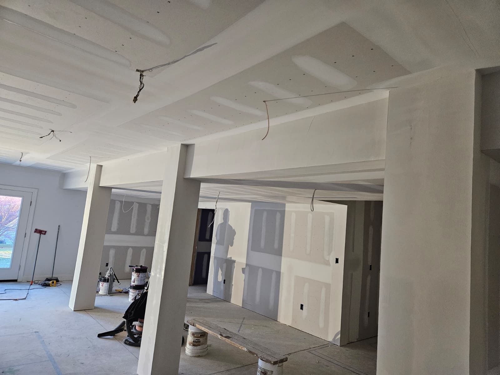 Basement remodel with new walls and columns wrapped