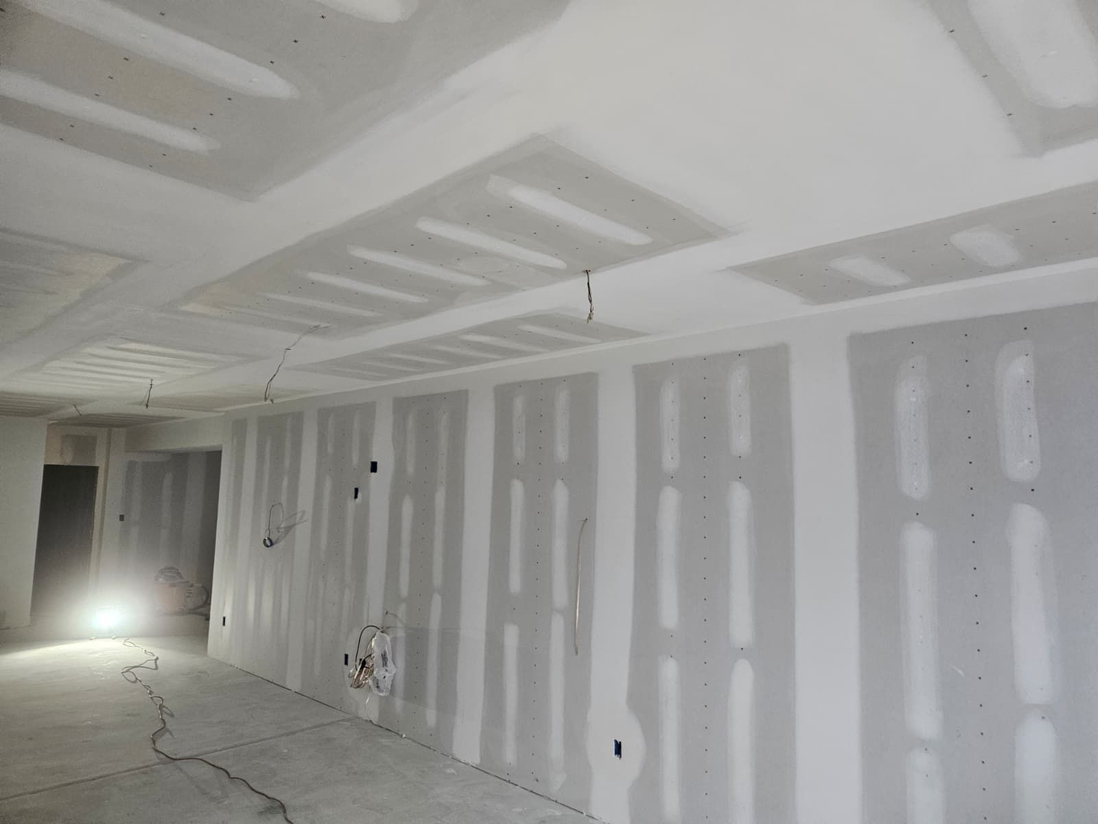 Remodeled basement with new walls and ceiling